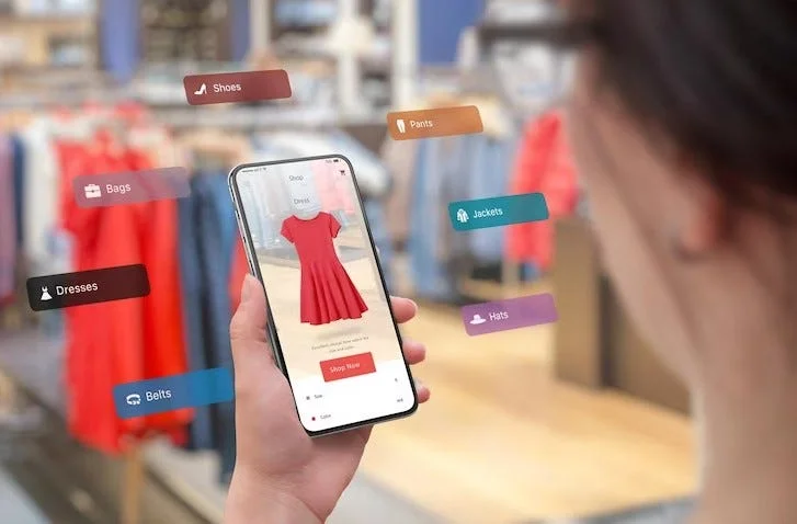 ecommerce app UAE woman choosing dress on her mobile phone