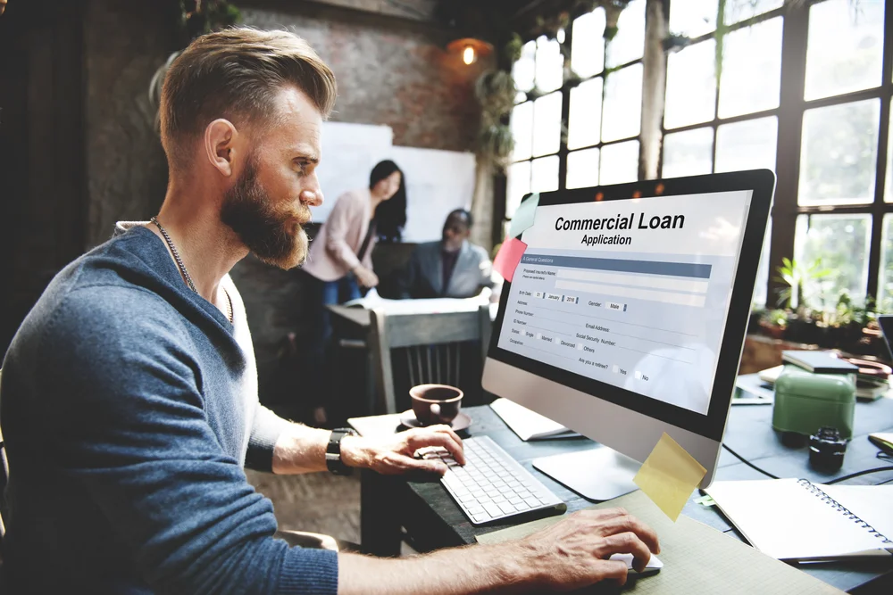 man applying for commercial loan online
